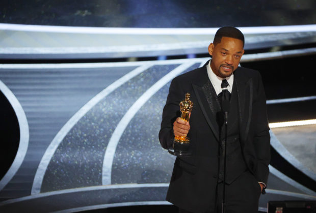 Will Smith wins the Oscar for Best Actor in "King Richard" at the 94th Academy Awards in Hollywood, Los Angeles, California, U.S., March 27, 2022. REUTERS/Brian Snyder/File Photo