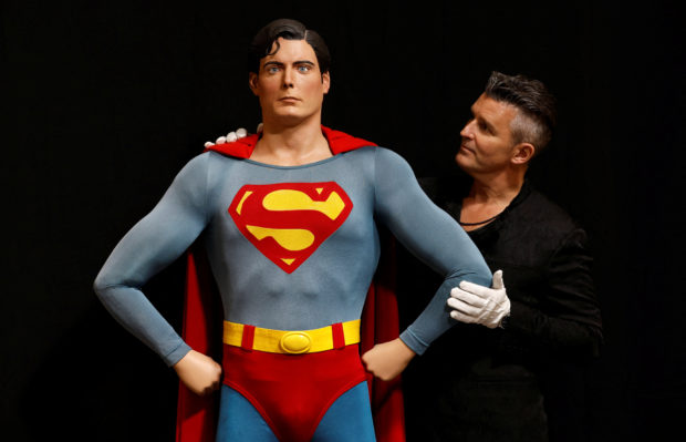 Propstore CEO Stephen Lane stands with Superman's (Christopher Reeve) complete costume from "Superman" franchise movies at a Propstore facility in Rickmansworth, Britain, September 27, 2022. REUTERS/Peter Cziborra