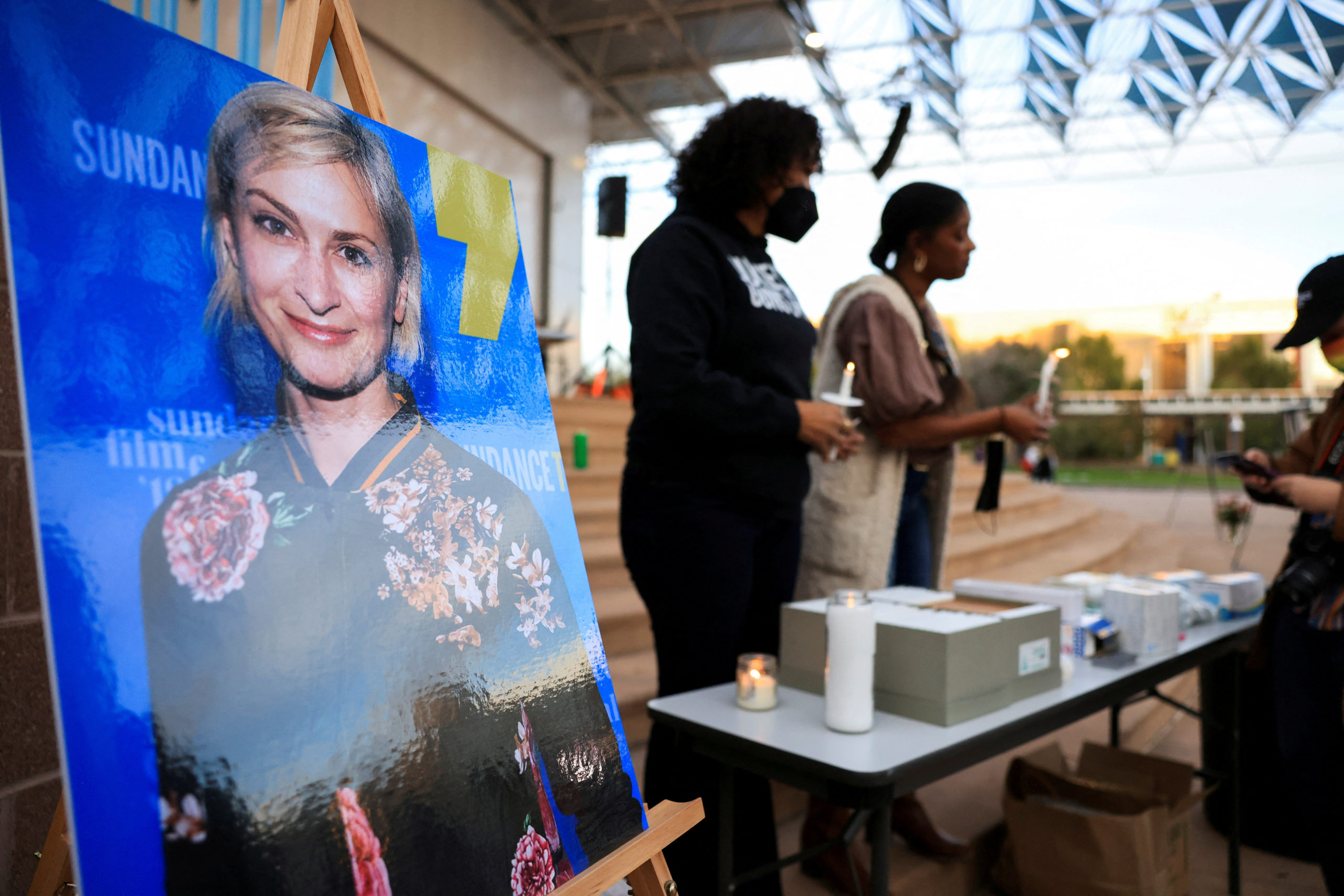 An image of cinematographer Halyna Hutchins, who died after being shot by Alec Baldwin on the set of his movie "Rust", is displayed at a vigil in her honour in Albuquerque, New Mexico, U.S., October 23, 2021.  REUTERS/Kevin Mohatt/File Photo