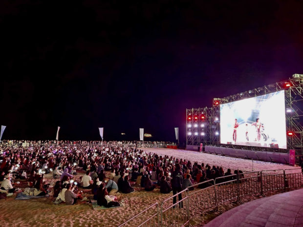 Crowds are gathered at the beach to watch "BTS' 'Yet To Come' in Busan" through real-time Live Play in Haeundae, Busan. (Big Hit Music)