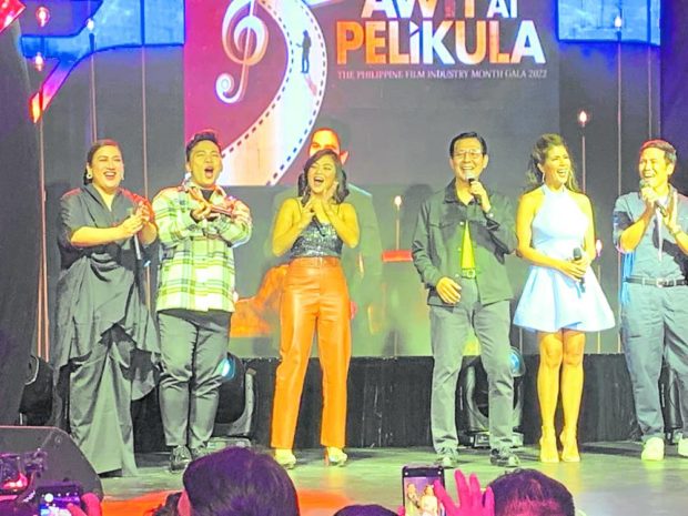 Film Development Council of the Philippines chair Tirso Cruz III (fourth from left) joins the closing number.