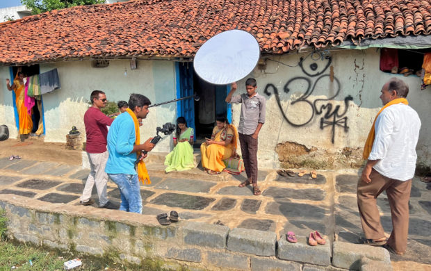 Residents film fellow villagers as they enact a scene for a social drama that they are making for their YouTube channel in Tulsi village