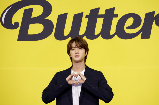 FILE PHOTO: K-pop boy band BTS member Jin poses for photographs during a photo opportunity promoting their new single 'Butter' in Seoul, South Korea, May 21, 2021. REUTERS/Kim Hong-Ji