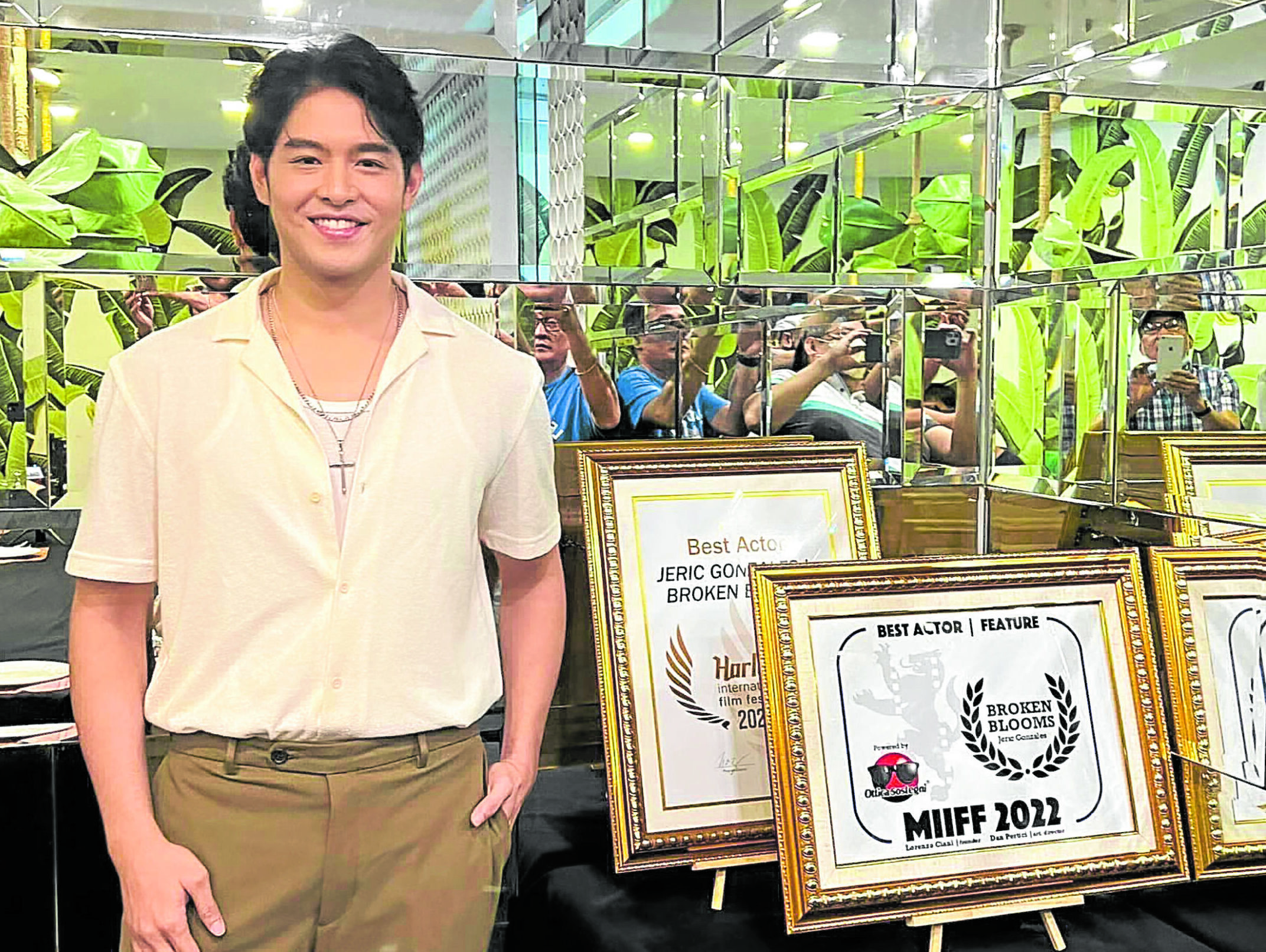 Jeric Gonzales poses with his citations.