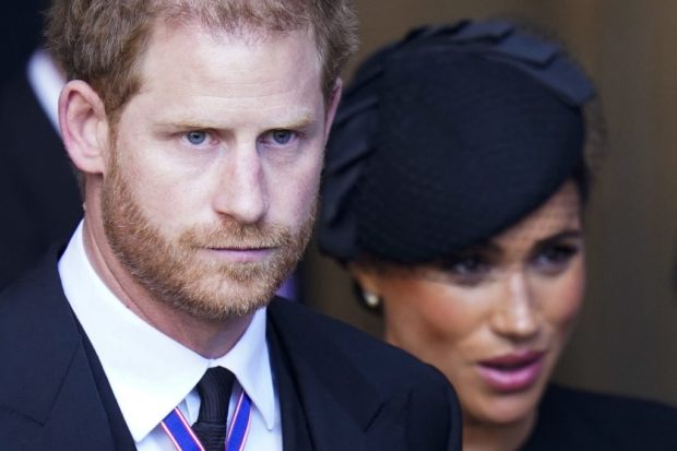 Britain's Prince Harry, Duke of Sussex and Meghan, Duchess of Sussex leave after a service for the reception of Queen Elizabeth II's coffin at Westminster Hall, in the Palace of Westminster in London on September 14, 2022, where the coffin will Lie in State. - Queen Elizabeth II will lie in state in Westminster Hall inside the Palace of Westminster, from Wednesday until a few hours before her funeral on Monday, with huge queues expected to file past her coffin to pay their respects. (Photo by Danny Lawson / POOL / AFP)
