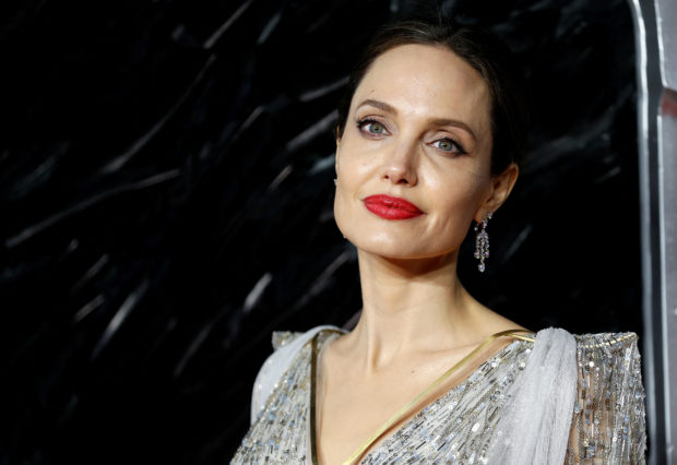 FILE PHOTO: Actor Angelina Jolie poses as she attends the UK premiere of "Maleficent: Mistress of Evil" in London, Britain October 9, 2019. REUTERS/Peter Nicholls/File Photo