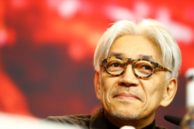 FILE PHOTO: Composer Ryuichi Sakamoto and member of the jury for the 68th Berlinale International Film Festival attends a news conference in Berlin