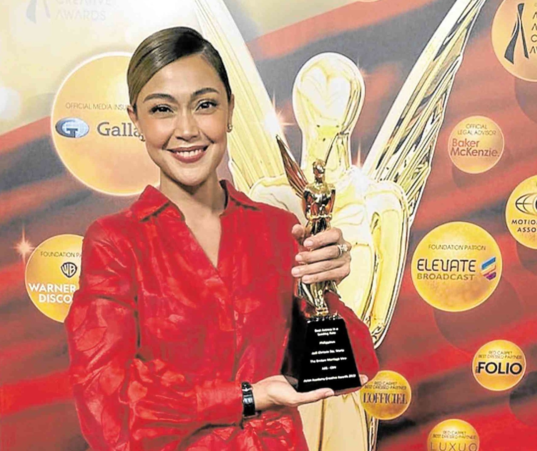 Jodi Sta. Maria receives her best actress award in Singapore.