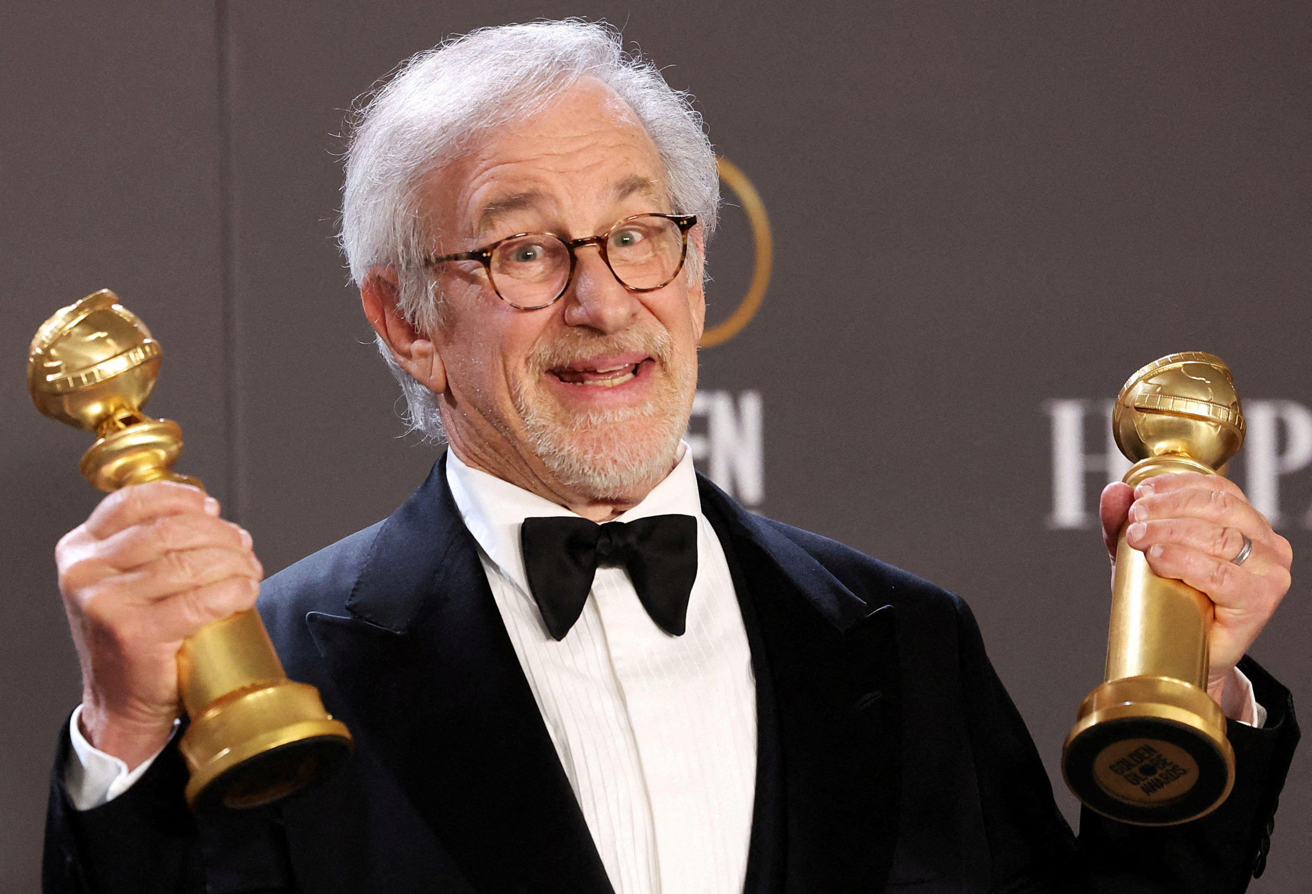Steven Spielberg poses with his awards for Best Director in a Motion Picture and Best Picture Drama for "The Fabelmans" at the 80th Annual Golden Globe Awards in Beverly Hills, California, U.S., January 10, 2023. REUTERS/Mario Anzuoni