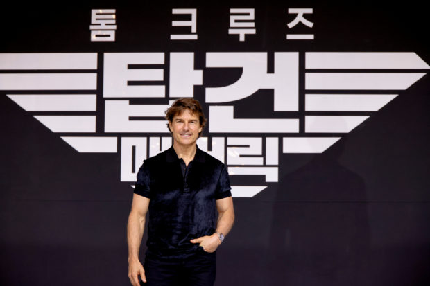 FILE PHOTO: Cast member and producer Tom Cruise poses for photographs during a news conference to promote the film 'Top Gun: Maverick' at a hotel in Seoul, South Korea, June 20, 2022.  REUTERS/Heo Ran