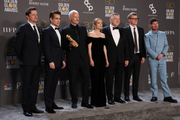 FILE PHOTO: Director Martin McDonagh, cast members and crew of "The Banshees of Inisherin" pose with their award for Best Motion Picture in a Musical or Comedy,  at the 80th Annual Golden Globe Awards in Beverly Hills, California, U.S., January 10, 2023. REUTERS/Mario Anzuoni