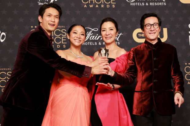 FILE PHOTO: Harry Shum Jr., Stephanie Hsu, Michelle Yeoh, and Ke Huy Quan pose with the Best Picture award for "Everything Everywhere All at Once" at the 28th annual Critics Choice Awards in Los Angeles, California, U.S., January 15, 2023. REUTERS/Aude Guerrucci