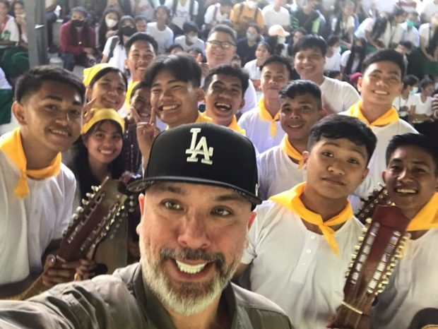 Filipino-American stand-up comedian and actor Jo Koy takes a groufie with students of the Alangilan National High School in Bacolod City on Friday, Jan. 6, 2023. (Photo courtesy of Gervie Jude Tolimao) Jo koy bacolod donated road