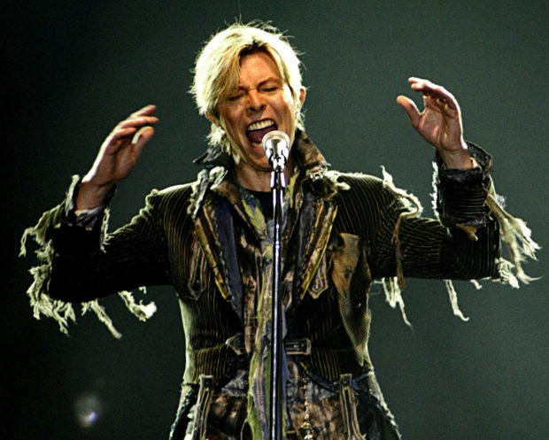 FILE PHOTO: British singer David Bowie performs in a concert during his worldwide tour called "A Reality Tour" at T-mobile arena in Prague, June 23, 2004. REUTERS/David W Cerny/File Photo