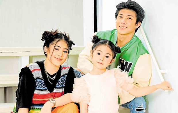 Niana (left) with sister Natalia (center) and brother Ranz Kyle