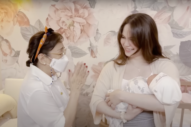 (From left) Vilma Santos, Jessy Mendiola while cradling baby Isabella Rose. Image: Screengrab from YouTube/Jessy Mendiola