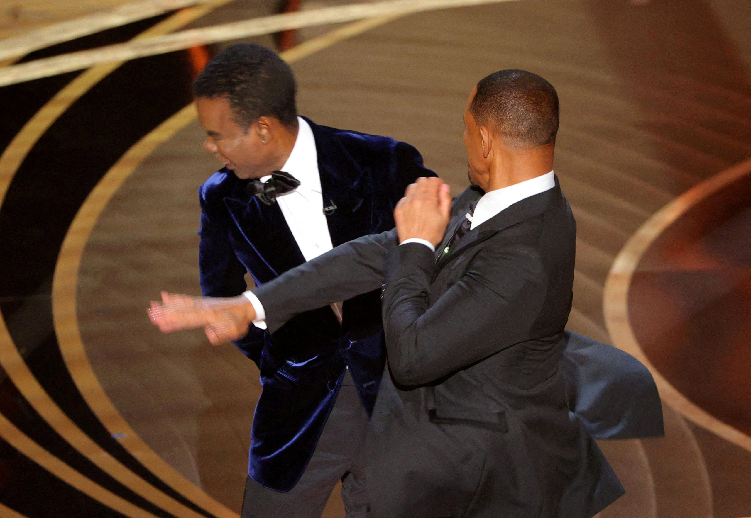 FILE PHOTO: Will Smith hits Chris Rock onstage during the 94th Academy Awards in Hollywood, Los Angeles, California, U.S., March 27, 2022. REUTERS/Brian Snyder/File Photo