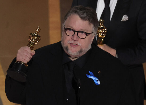 Guillermo del Toro accepts the Oscar for Best Animated Feature Film for "Guillermo Del Toro's Pinocchio" during the Oscars show at the 95th Academy Awards in Hollywood, Los Angeles, California, U.S., March 12, 2023. REUTERS/Carlos Barria