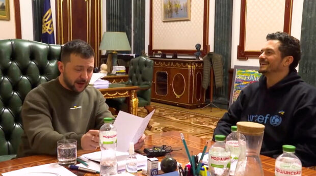 Orlando Bloom and Ukraine's President Volodymyr Zelensky hold a meeting to discuss humanitarian aid projects and issues of reconstruction focused on the interests of children, in this screengrab from a video obtained from social media on March 26, 2023. @zelenskiy_official/via REUTERS