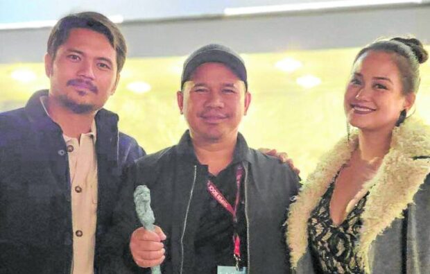 Director TM Malones (center) with Jess Mendoza (left) and Max Eigenmann