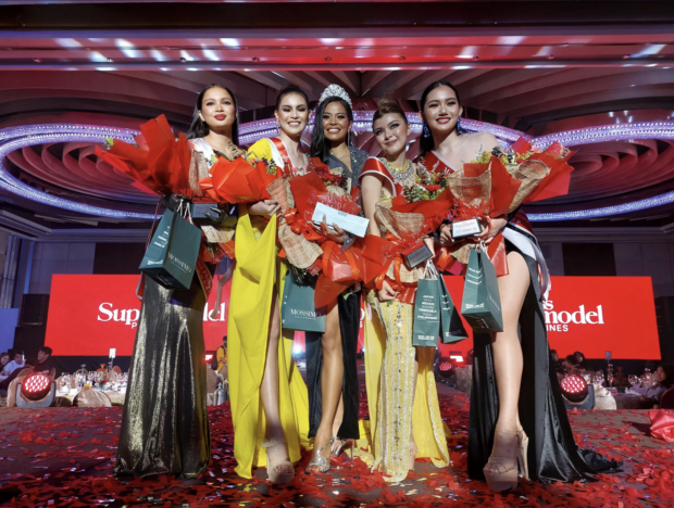 Miss Supermodel Philippines Shyrla Nuñez (center) is flanked by her runners-up (from left) Floriane Lajara, Querubin Gonzalez, Aileen Santiago, and Imogene Belles./ARMIN P. ADINA