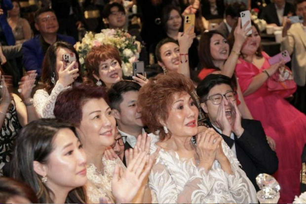 Family cheering while watching a live broadcast from Kuala Lumpur of Michelle Yeoh receiving the best actress award for Everything Everywhere All At Once. PHOTO: THE STAR/ASIA NEWS NETWORK via ANN