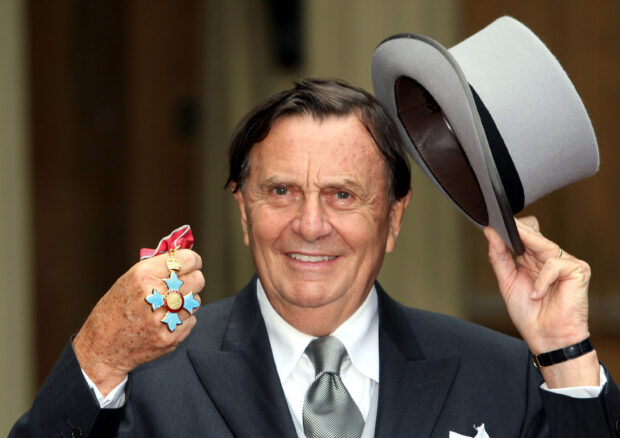 FILE PHOTO: Australia's Barry Humphries poses after receiving his Most Excellent Order of the British Empire from the Queen at Buckingham Palace, London October 10, 2007.    REUTERS/Steve Parsons/Pool