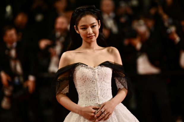 South Korean singer and actress Jennie Kim arrives for the screening of the film "The Idol" during the 76th edition of the Cannes Film Festival in Cannes, southern France, on May 22, 2023. (Photo by LOIC VENANCE / AFP)