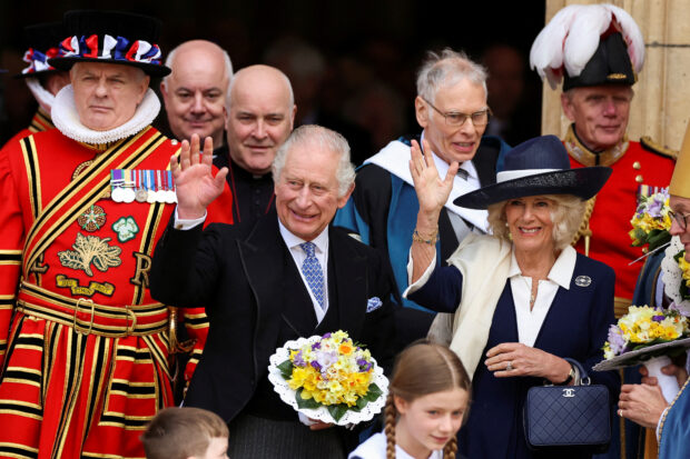 FILE PHOTO: Britain's King Charles and Camilla, Queen Consort wave as they attend the Maundy Thursday Service at York Minster, in York, Britain, April 6, 2023. REUTERS/Phil Noble/