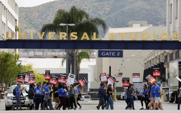 Workers and supporters of the Writers Guild of America protest outside Universal Studios Hollywood after union negotiators called a strike for film and television writers, in the Universal City area of Los Angeles, California, U.S., May 3, 2023. REUTERS/Mario Anzuoni
