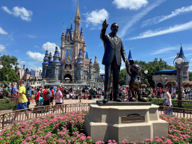FILE PHOTO: People gather at the Magic Kingdom theme park before the "Festival of Fantasy" parade at Walt Disney World in Orlando, Florida, U.S. July 30, 2022.  REUTERS/Octavio Jones/File Photo