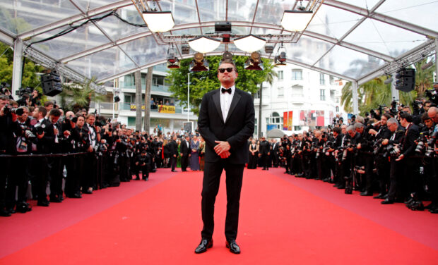 FILE PHOTO: 72nd?Cannes?Film Festival - Screening of the film "Ice on Fire" - Red Carpet Arrivals -?Cannes, France, May 22, 2019. Producer Leonardo DiCaprio poses. REUTERS/Jean-Paul Pelissier/File Photo
