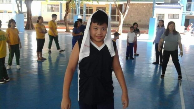 Izaac 'Zac' plays basketball in a special school in Marikina two years ago prior to the pandemic and before he grew taller than his mother Arlene.