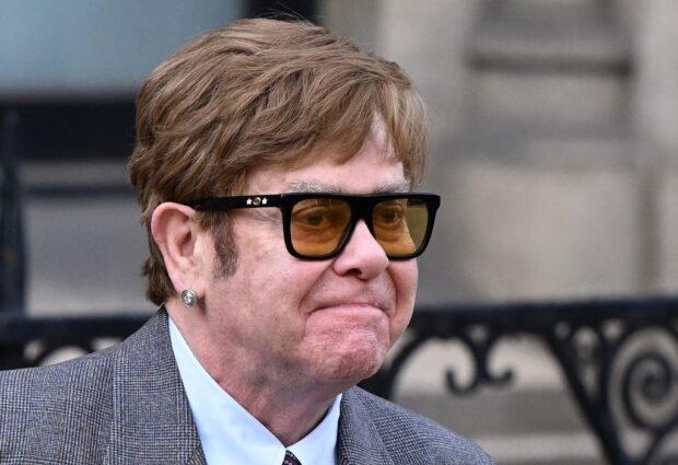 English singer Elton John leaves from the Royal Courts of Justice, Britain's High Court, in central London on March 27, 2023. (Photo by JUSTIN TALLIS / AFP)