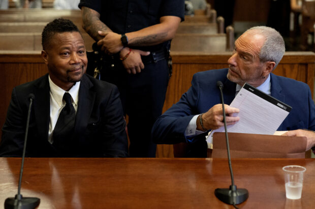 Actor Cuba Gooding Jr. appears with his attorney Frank Rothman in New York Criminal Court for his sentencing hearing after he pleaded guilty to a misdemeanor count of forcibly touching a woman at a New York nightclub in 2018, in Manhattan in New York City, New York, U.S., October 13, 2022. REUTERS/Mike Segar/File Photo