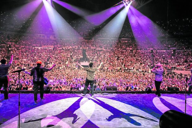 Bruno Mars with his band The Hooligans