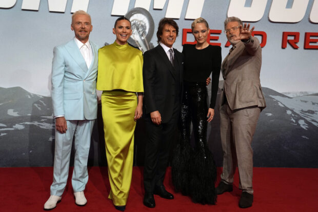 From left to right; actor Simon Pegg, Hayley Atwell, Tom Cruise, Pom Klementieff and director Christopher McQuarrie pose for photographers upon arrival at the premiere of the film "Mission Impossible, Dead Reckoning Part One", at the Emirates Palace in Abu Dhabi, United Arab Emirates, Monday, June 26, 2023. (AP Photo/Kamran Jebreili)