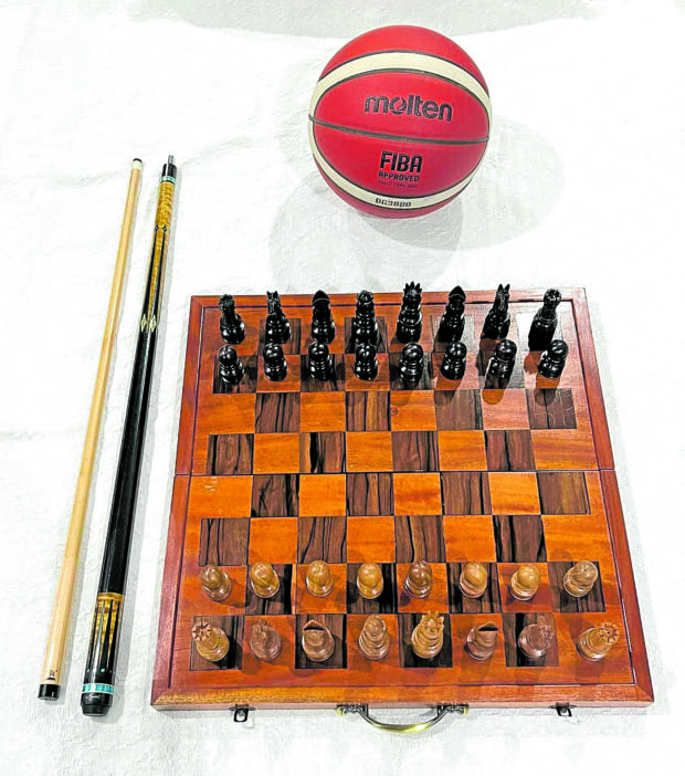 Masa’s cue stick, basketball and chess set