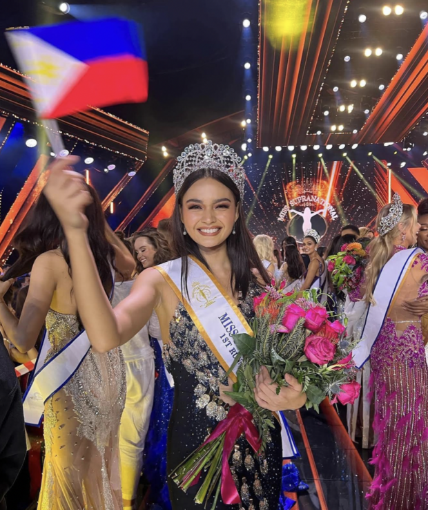 Miss Supranational first runner-up Pauline Amelinckx waving a Philippine flag.