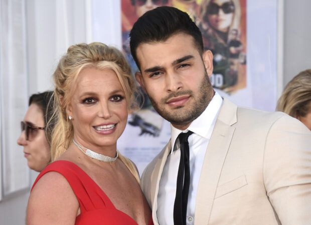 FILE - Britney Spears and Sam Asghari appear at the Los Angeles premiere of "Once Upon a Time in Hollywood" on July 22, 2019. Asghari has filed for divorce from Spears, a person familiar with the filing said late Wednesday, Aug. 16, 2023. The person, who is close to Asghari but not authorized to speak publicly, confirmed the filing happened Wednesday, hours after several outlets including TMZ and People magazine reported the couple had separated. (Photo by Jordan Strauss/Invision/AP, File)