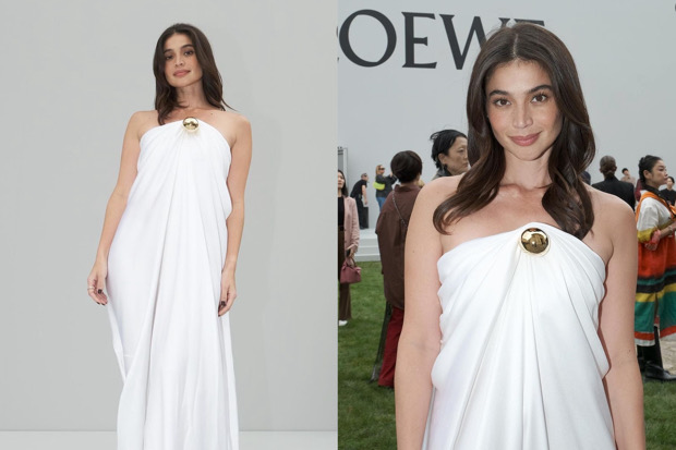 Anne Curtis wears a ghost-white, strapless dress with a round gold detail on the chest to the Paris Fashion Week.