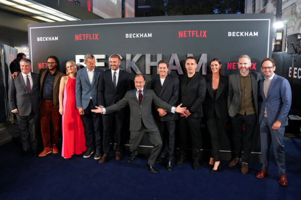Director Fisher Stevens and former football player David Beckham pose for a group photo at the premiere of a Netflix documentary called 'Beckham' in London, Britain October 3, 2023. REUTERS/Maja Smiejkowska