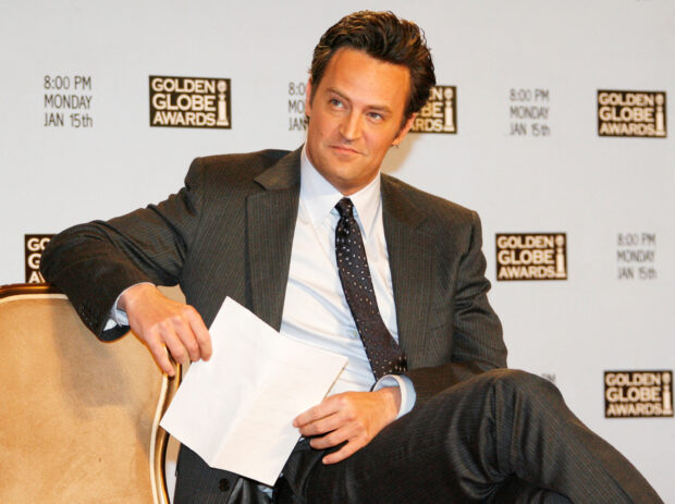 FILE PHOTO: Actor Matthew Perry waits to announce the nominations for the Golden Globe Awards during a news conference in Beverly Hills, California, December 14, 2006. REUTERS/Fred Prouser/File Photo
