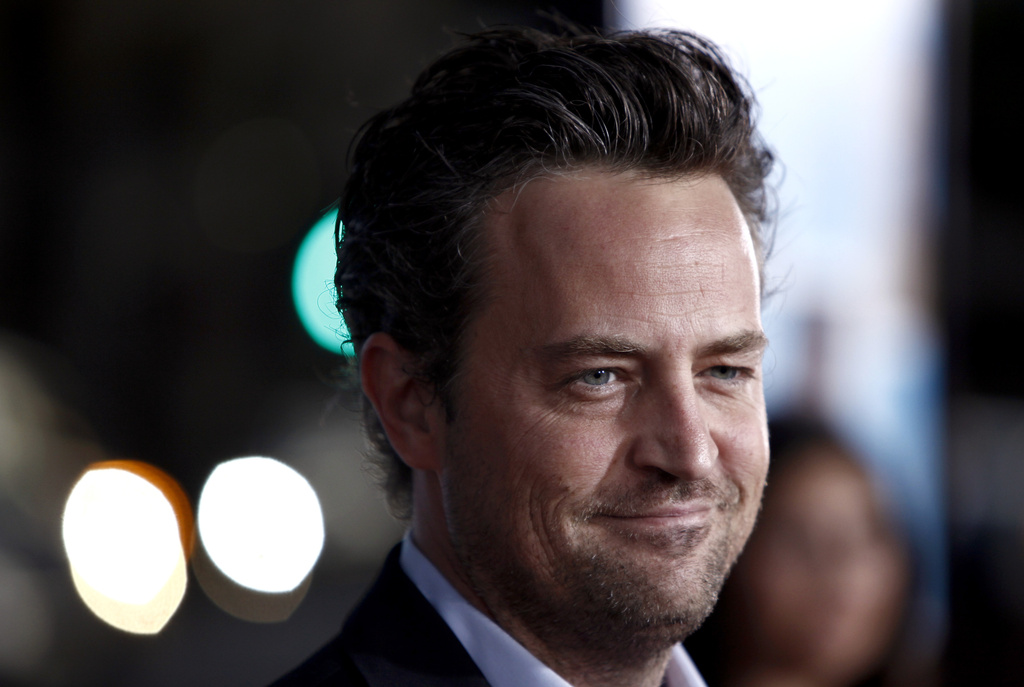 Matthew Perry arrives at the premiere of "The Invention of Lying" in Los Angeles on Monday, Sept. 21, 2009. Perry, who starred as Chandler Bing in the hit series “Friends,” has died. He was 54. The Emmy-nominated actor was found dead of an apparent drowning at his Los Angeles home on Saturday, according to the Los Angeles Times and celebrity website TMZ, which was the first to report the news. Both outlets cited unnamed sources confirming Perry’s death. His publicists and other representatives did not immediately return messages seeking comment. (AP Photo/Matt Sayles, File)