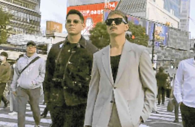 Jake Cuenca (right) with “The Iron Heart” costar Richard Gutierrezat Shibuya Crossing in Tokyo. —JAKE CUENCA/INSTAGRAM