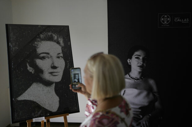 painting of Maria Callas being photographed