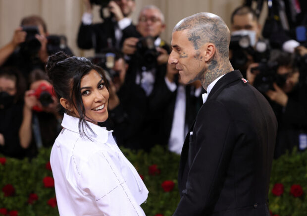 FILE PHOTO: Travis Barker and Kourtney Kardashian arrive at the In America: An Anthology of Fashion themed Met Gala at the Metropolitan Museum of Art in New York City, New York, U.S., May 2, 2022. REUTERS/Andrew Kelly/File Photo