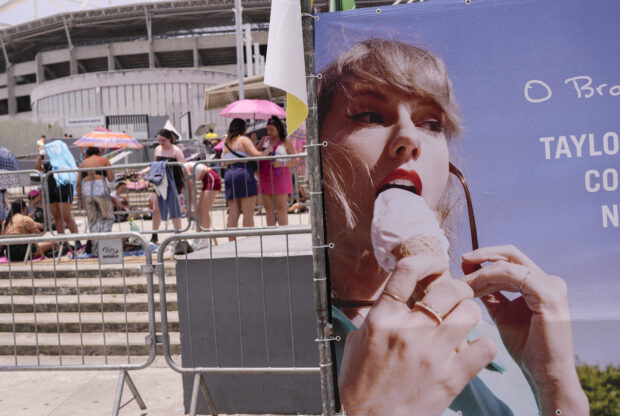 Taylor Swift (right) and Swifties in Rio de Janeiro