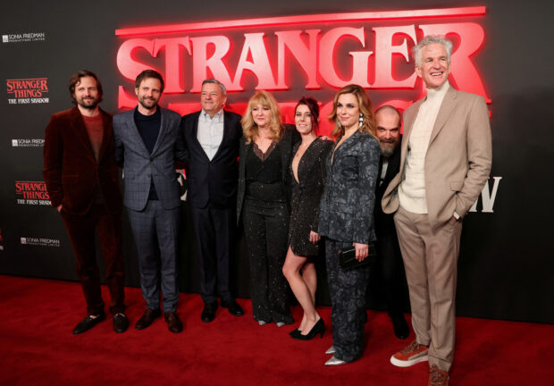 Film producers Ross Duffer and Matt Duffer, Netflix Co-CEO Ted Sarandos, producer Sonia Friedman, actors David Harbour, Matthew Modine, Cara Buono and writer Kate Trefry attend the opening night for 'Stranger Things: The First Shadow' at Phoenix Theatre in London, Britain, December 14, 2023. REUTERS/Isabel Infantes