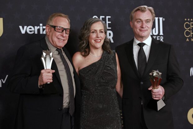 'Oppenheimer' wins big at Critics Choice Awards(From L) US producer Charles Roven, British producer Emma Thomas and British director Christopher Nolan, winners of the Best Picture award for “Oppenheimer,” pose in the press room during the 29th Annual Critics Choice Awards at the Barker Hangar in Santa Monica, California on January 14, 2024. (Photo by Michael TRAN / AFP)